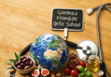 cibi tipici della dieta mediterranea e una scritta: giornata mondiale della salute