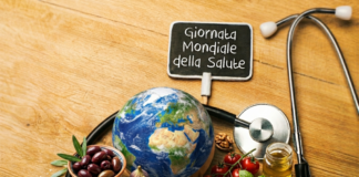 cibi tipici della dieta mediterranea e una scritta: giornata mondiale della salute
